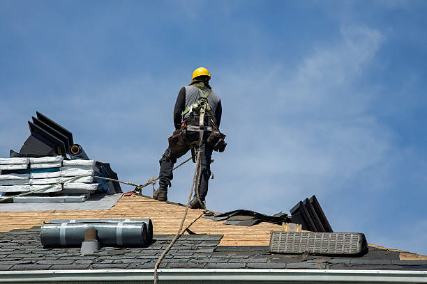 Professional Roof Replacement technician working in Brenham, TX